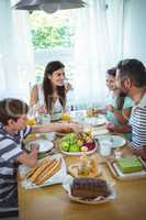 Happy family having breakfast