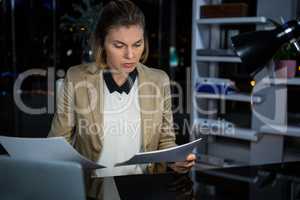 Businesswoman looking at documents