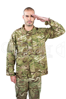Portrait of confident soldier saluting