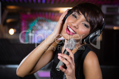 Woman singing in bar