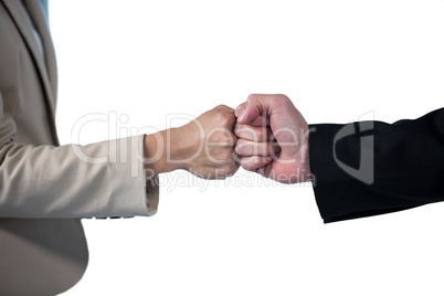 Business people giving fist bump
