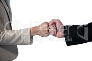 Business people giving fist bump