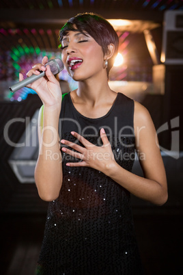 Woman singing in bar