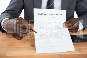 Businessman showing Last Will & Testament document