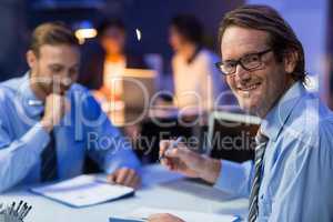 Businessman preparing document in conference room