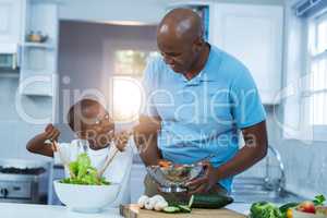 Father and son preparing food