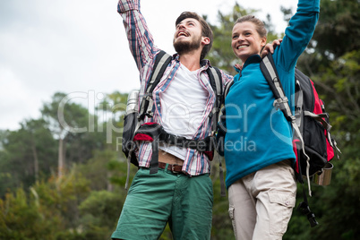 Excited hiker couple in forest