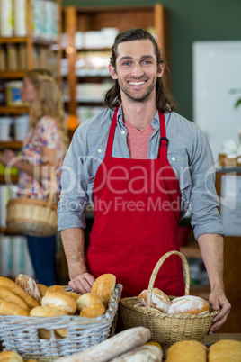 Portrait of male standing at bakery counter
