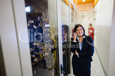 Technician talking on mobile phone