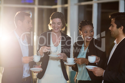 Group of businesspeople having coffee during break