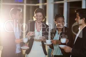 Group of businesspeople having coffee during break