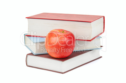 books and apple isolated on white background