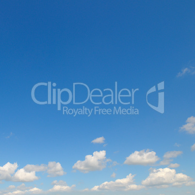 light cumulus clouds in the blue sky