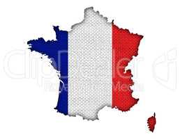 Karte und Fahne von Frankreich auf altem Leinen