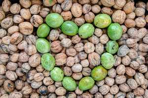 Ripe and unripe walnuts