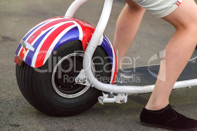 A young man on a scooter ( fragment).