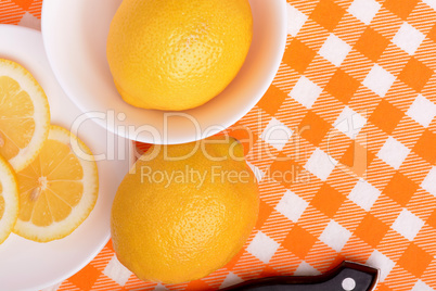 A slices of fresh yellow lemon. Lemon pieces in different sizes background