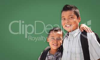 Cute Hispanic Boys In Front of Blank Chalk Board