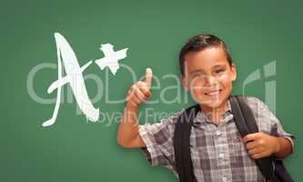 Hispanic Boy with Thumbs Up in Front of A+ Written on Chalk Boar
