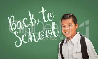 Hispanic Boy In Front of Back To School Chalk Board