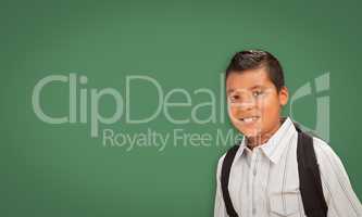 Cute Hispanic Boy In Front of Blank Chalk Board