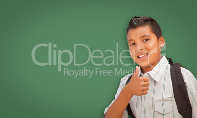 Cute Hispanic Boy In Front of Blank Chalk Board