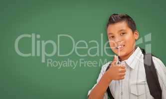 Cute Hispanic Boy In Front of Blank Chalk Board