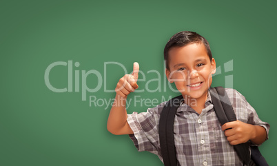 Cute Hispanic Boy In Front of Blank Chalk Board