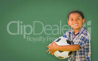 Cute Young Mixed Race Boy Holding Soccer Ball In Front of Blank