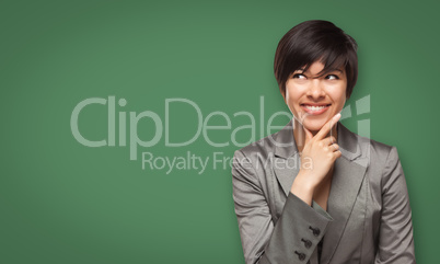 Attractive Young Woman Looking Up to Blank Chalk Board