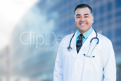 Hispanic Male Doctor or Nurse In Front Of Hospital