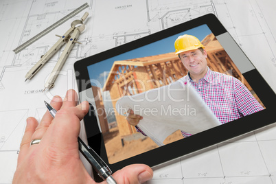 Architect Hand on Tablet Showing Contractor Over House Plans