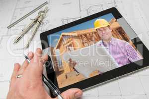 Architect Hand on Tablet Showing Contractor Over House Plans