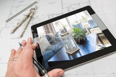 Architect Hand on Tablet Showing Home Interior Over House Plans