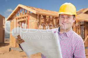 Contractor Wearing Hardhat Holding Blueprints at Home Constructi