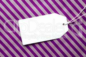Label On Purple Wrapping Paper And Copy Space