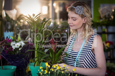 Female florist preparing flower bouquet Female florist preparing flower bouquet