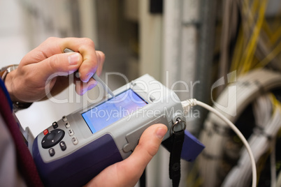 Technician using digital cable analyzer