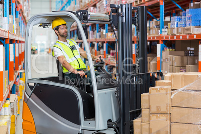 Male worker using forklift