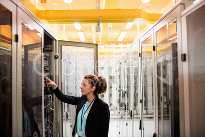 Technician examining server