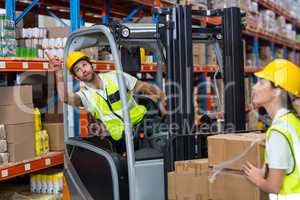 Male worker using forklift