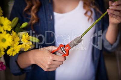 Female florist preparing flower bouquet