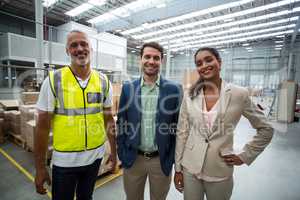 Portrait of warehouse team standing together