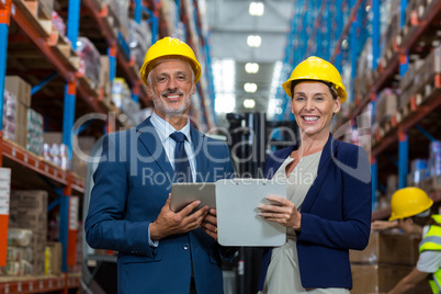 Warehouse manager and client smiling