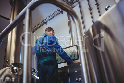 Manufacturer using computer at brewery