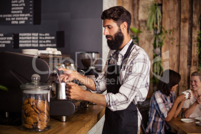 Waiter working in kitchen