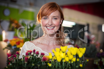 Female florist holding flower bouquet