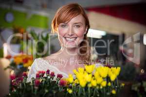 Female florist holding flower bouquet