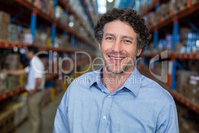 Portrait of smiling warehouse worker