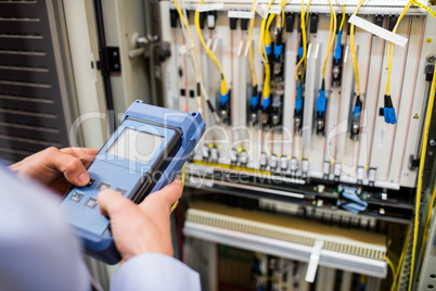 Technician using digital cable analyzer